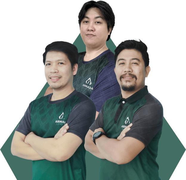 A trio of men dressed in armada logics green uniform shirts stands side by side, exuding camaraderie and positivity.