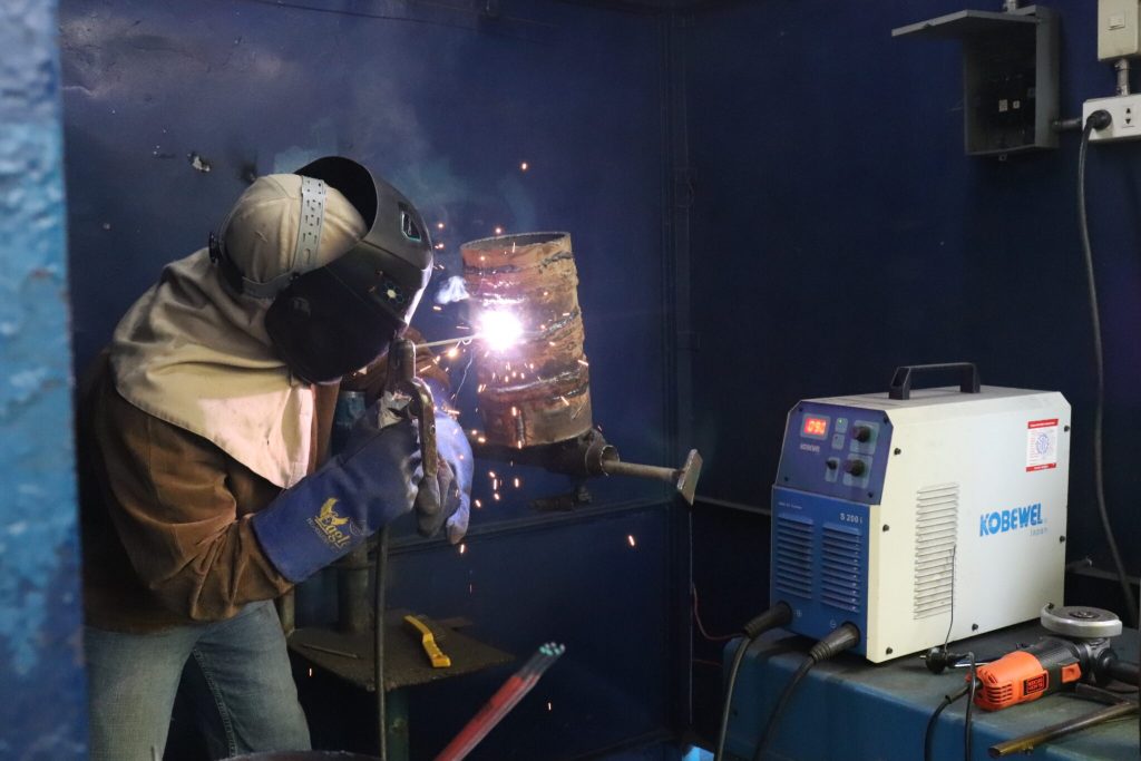 Man practicing welding through TESDA programs